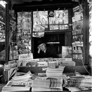 Street seller and newespapers